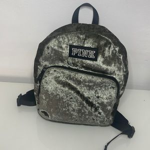 This is a mini Pink book bag This bag have two pockets and two adjustable straps